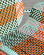 Emba Studio aluminum and synthetic rattan armchair